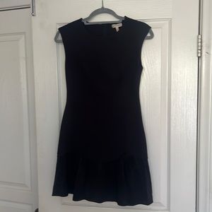 Navy fit and flare knit dress with satin ruffle at hem.